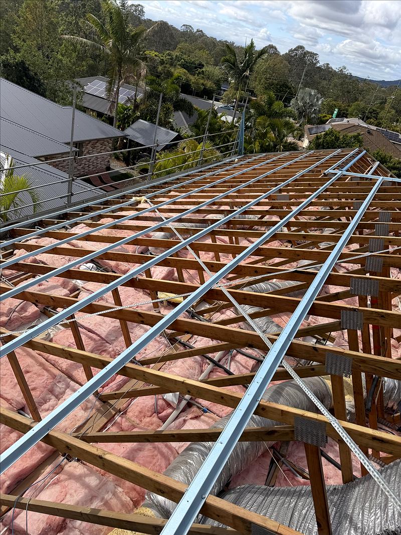Steel battens across the whole roof with scaffold edge protection around the house